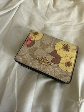 Coach Beige Signature Compact Wallet with Yellow Floral Accents